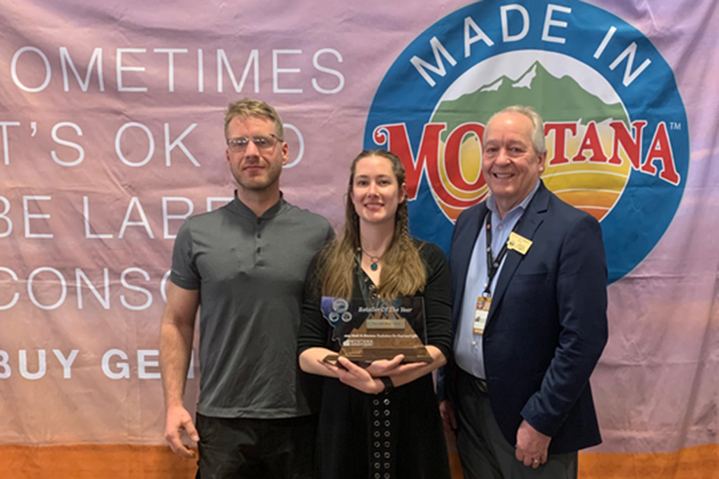 2023 Retailer of the Year Award recipients Brooke and Alex Blackler of Missoula with Commerce Director Scott Osterman