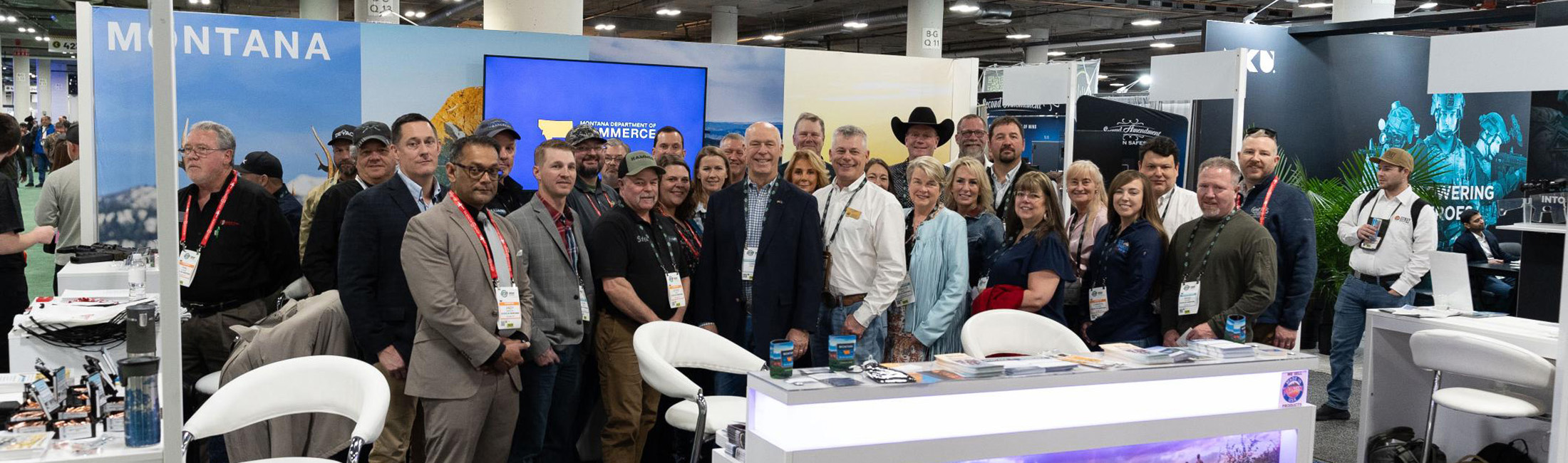 Governor Gianforte visits Director Paul Green and others at the Montana Department of Commerce 2025 SHOT Show booth. Photo by Sky Vault Media.