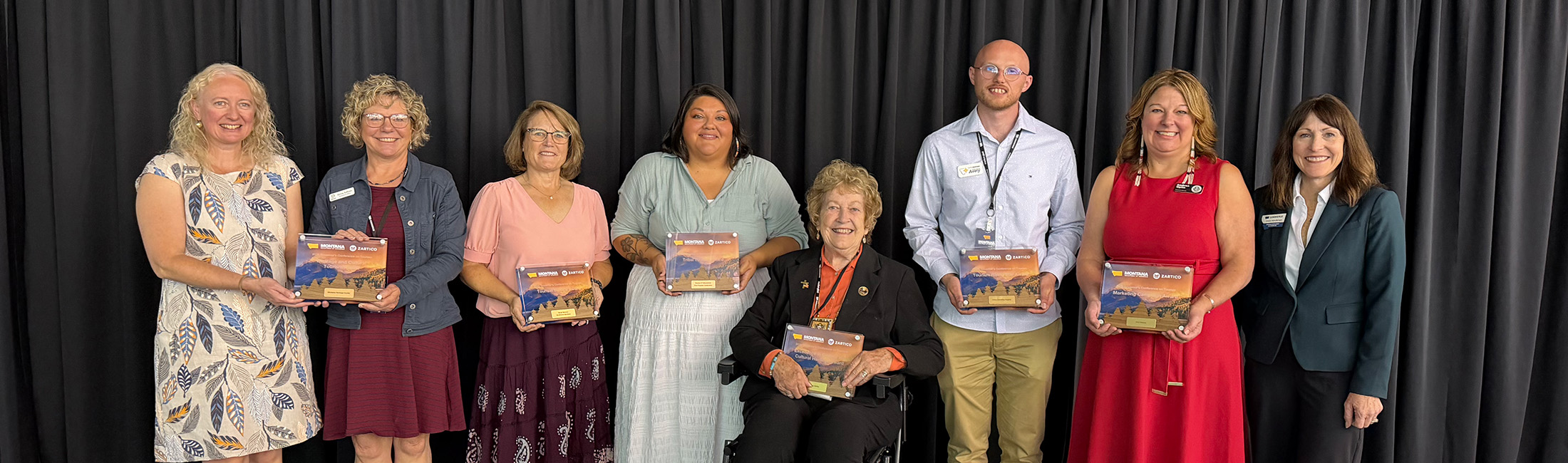 From left to right: Amanda Trum, museum manager, Montana Historical Society; Ginny Sullivan, public relations and development officer, Montana Historical Society; Sarah Bannon, retired executive director, Visit Southwest Montana; Alyssa McGeeley, tribal engagement manager, Yellowstone Forever; Norma Ashby Smith, retired broadcaster, Montana Television Network; Avery Hughes, tourism director, Central Montana; Andrea Opitz, executive director, Visit Helena; Marta Bertoglio, director, Montana Department of Commerce. 
